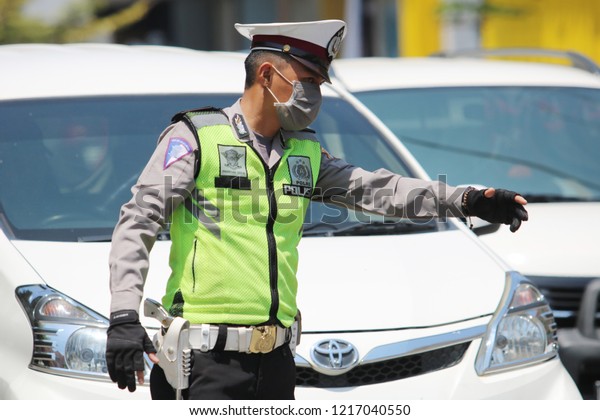 MAKASSAR, INDONESIA - OCTOBER 31 2018: Vehicle
inspections carried out by police officers against a number of
vehicles in the city of Makassar. Inspections in the context of
zebra operation