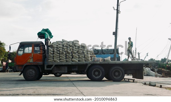 Makassar, South Sulawesi, Indonesia. July 18, 2021.\
The activity of an old truck carrying cargo at the Makassar paotere\
port.