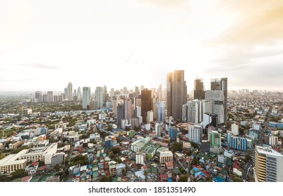 Makati, Metro Manila, Philippines - Nov 2020: The Makati Skyline As Seen From Mandaluyong. Intense Sun Glare And Dramatic Urban Shot.