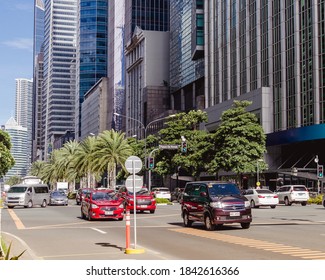 Makati, Metro Manila, Philippines - Oct 2020: Cars Ply Through Ayala Avenue, The Main Thoroughfare In The City's CBD.