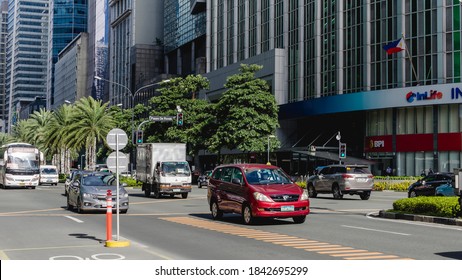 Makati, Metro Manila, Philippines - Oct 2020: Cars Ply Through Ayala Avenue, The Main Thoroughfare In The City's CBD.