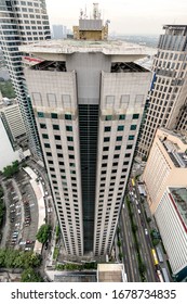 Makati, Philippines - Jan 2016: Looking Down At A Office Building And Ayala Avenue From A Taller Skyscraper