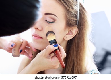 Make Up Artist Apply Base Foundation On The Model Face