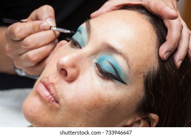 Make Up Artist Creating Cat Eyes On A White Woman