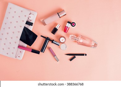 Make up bag with cosmetics isolated on pink background - Shutterstock ID 388366768