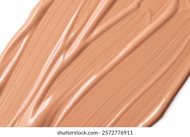 Make up base, cream textured background. Beige nude liquid foundation texture, concealer smear smudge. BB CC Cream Concealer texture swatch sample.