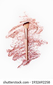 Make up brush and cosmetic gel for a body with glitter and spangles isolated on white
