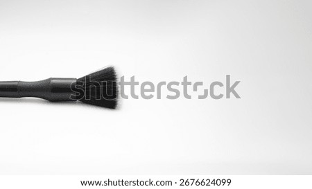 MAKE UP BRUSH ON A WHITE SURFACE SPACE TO AD YOUR TEXT