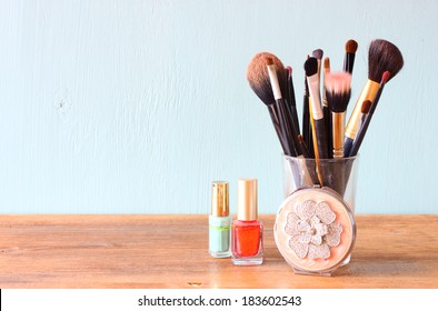 Make Up Brushes Over Wooden Table 