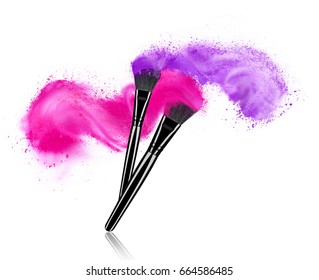 Make up brushes with powder splashes isolated on white background