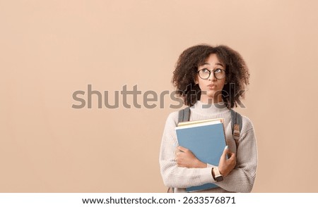 Make choices or think about study, problems at education. Pensive african american woman student in glasses with backpack holds notepads and looks up to free space