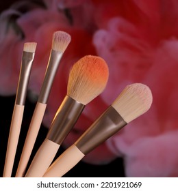 Make up cosmetic brush, colored pink background