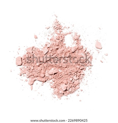 Make up crushed and broken brown eyeshadow on white background. Texture of crushed bronz powder