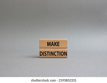 Make distinction symbol. Concept words make distinction on wooden blocks. Beautiful grey background. Business and make distinction concept. Copy space. - Shutterstock ID 2193852331