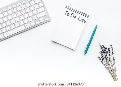 Make to do list. Notebook near branches of lavender and keyboard on white background top view copyspace