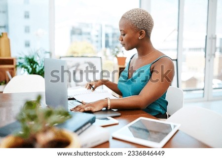 Make every minute of the workday count. Shot of a young businesswoman working at her desk in a modern office.