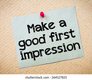 Make a first good impression Message. Recycled paper note pinned on cork board. Concept Image - Shutterstock ID 264527825