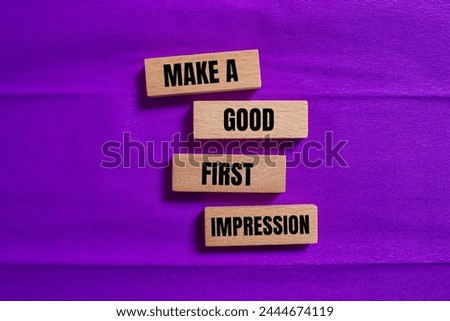 Make a good first impression words written on wooden blocks with purple background. Conceptual symbol. Copy space.