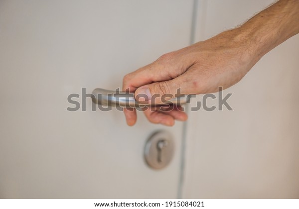 Make hand grab\
doorknob latch to open steel door to enter building, security lock\
for entrance and doorway