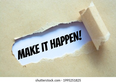 Make it happen! appearing behind torn brown paper.