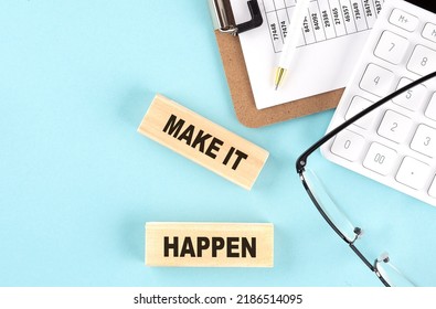 MAKE IT HAPPEN text written on a wooden block with clipboard ,eye glasses and calculator Business concept.