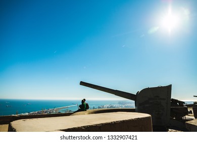 Make love do not make war. Couple at gunpoint. Couple dating with ocean view. Couple dating in peace.