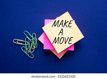 Make a Move symbol. Steaky Notes with Concept words Make a Move. Beautiful deep blue background. Business and Make a Move concept. Copy space.