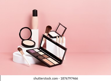 Make up products prsented on white podiums on pink pastel background. Mockup for branding and packaging presentation 