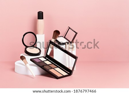 Make up products prsented on white podiums on pink pastel background. Mockup for branding and packaging presentation  Foto stock © 