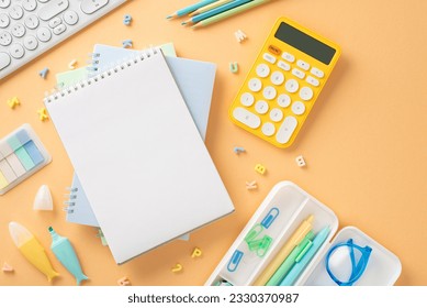 Make statement this school year with this stunning image. Top view of stationery, gadgets and open notepad on pastel orange backdrop, providing ideal space for your custom text or advert