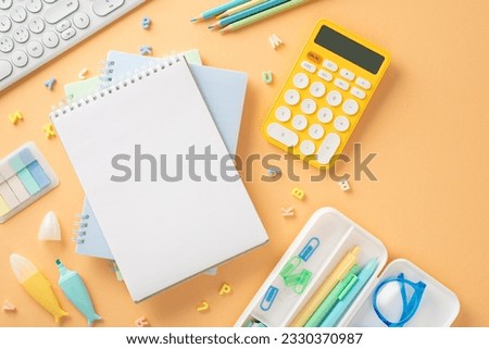 Make statement this school year with this stunning image. Top view of stationery, gadgets and open notepad on pastel orange backdrop, providing ideal space for your custom text or advert