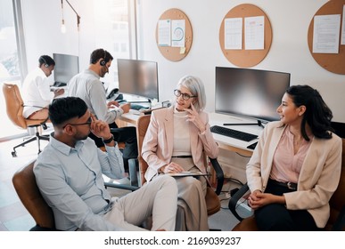 Make Sure Your Ideas Are Heard. High Angle Shot Of A Diverse Group Of Businesspeople Sitting In The Office Together And Having A Discussion.