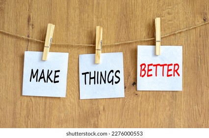 Make things better symbol. Concept words Make things better on white paper on wooden clothespin on a beautiful grey table grey background. Business and make things better concept. Copy space. - Shutterstock ID 2276000553