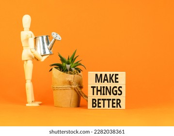 Make things better symbol. Concept words Make things better on wooden block on a beautiful orange table orange background. Businessman icon. Business and make things better concept. Copy space.