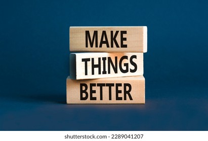 Make things better symbol. Concept words Make things better on wooden block on a beautiful grey table grey background. Business and make things better concept. Copy space.