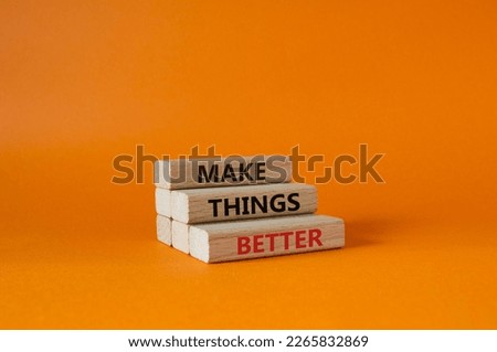 Make things better symbol. Concept word Make things better on wooden blocks. Beautiful orange background. Business and Make things better concept. Copy space