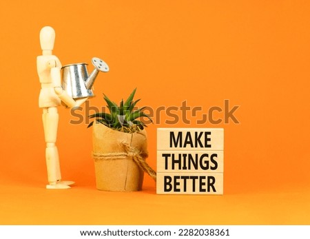 Make things better symbol. Concept words Make things better on wooden block on a beautiful orange table orange background. Businessman icon. Business and make things better concept. Copy space.