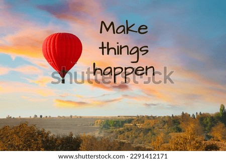 Make things happen, affirmation. Bright hot air balloon flying over countryside