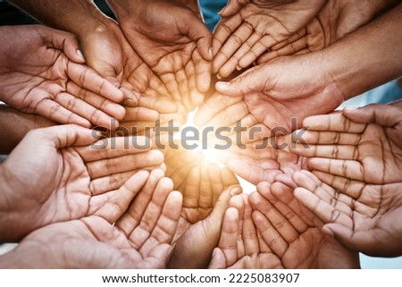 Make this world a brighter place. Cropped shot of a diverse group of people holding out their cupped hands.