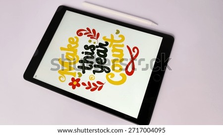  Make this year count lettering on tablet