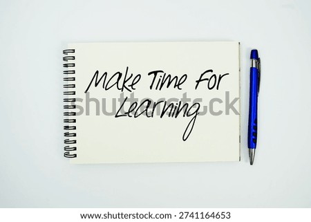 Make Time for Learning message written on notepad with pen on white background