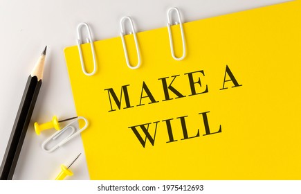 MAKE A WILL Word On The Yellow Paper With Office Tools On White Background