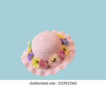 Make Your Own Easter Bonnet with Fresh Flowers. Be great for kids to dress up as the queen for the Platinum Jubilee with these. Straw hat with fresh flowers and ribbon as decoration. 