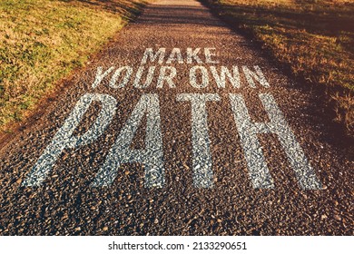 Make Your Own Path Motivational Quote On Footpath Leading Through Park In Diminishing Perspective, Selective Focus