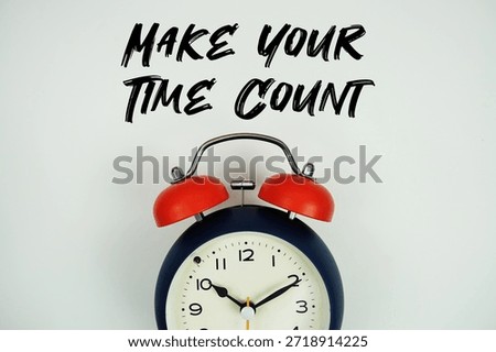 Make Your Time Count text with alarm clock flat lay on white background
