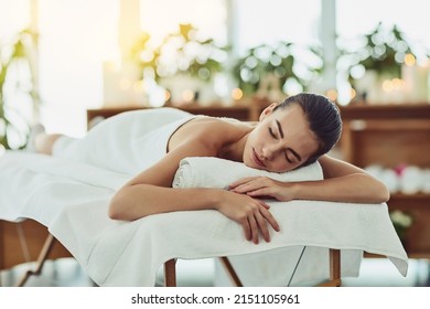 Make your wellbeing a priority today. Shot of an attractive young woman getting pampered at a beauty spa. - Powered by Shutterstock