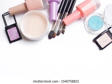 Makeup accesorries background. Nail polish, eyshadows, makeup brushes, powder. - Shutterstock ID 1540758821