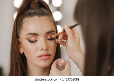 Makeup Artist Applies Eye Shadow, Perfect Evening Makeup. Beauty Redhead Girl With Perfect Skin And Freckles