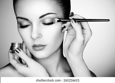 Makeup Artist Applies Eye Shadow. Beautiful Woman Face. Perfect Makeup. Black And White