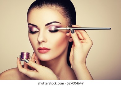 Makeup Artist Applies Eye Shadow. Beautiful Woman Face. Perfect Makeup. Makeup Detail. Beauty Girl With Perfect Skin. Nails And Manicure